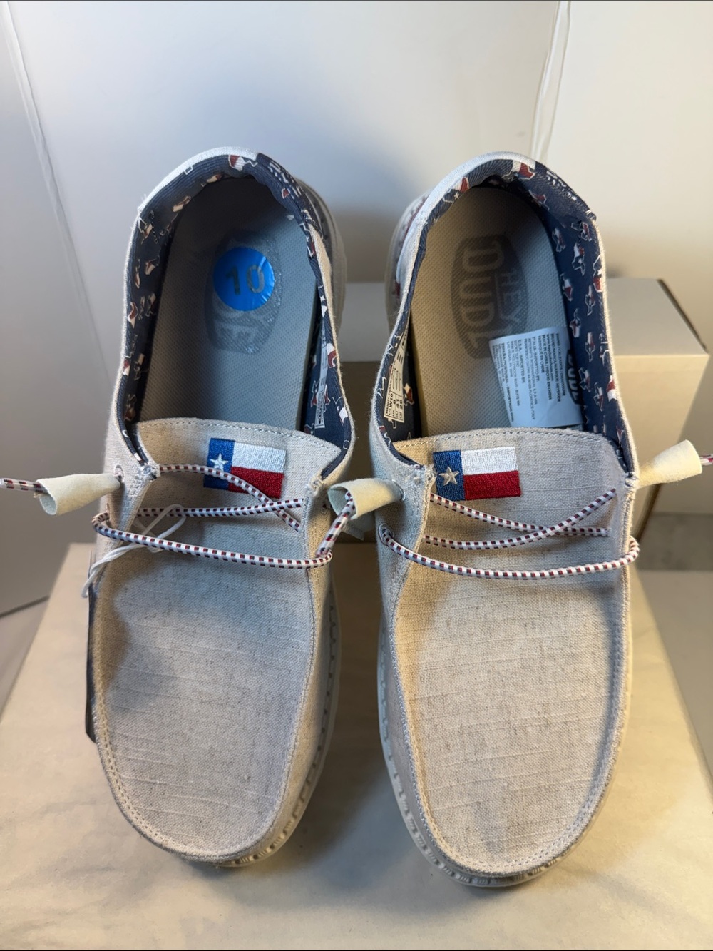 Hey Dude Beige Canvas Slip-Ons with Texas Flag Tongue Detail